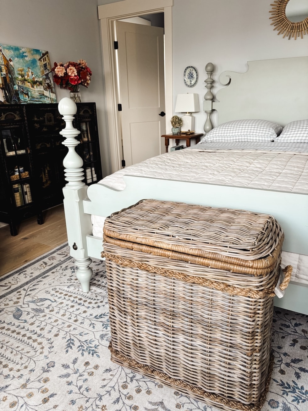 lidded basket for storing blankets in bedroom