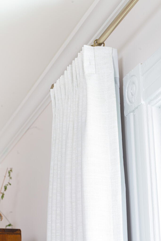 looking closely at pleated heading on TwoPages ready made drapes on a window.