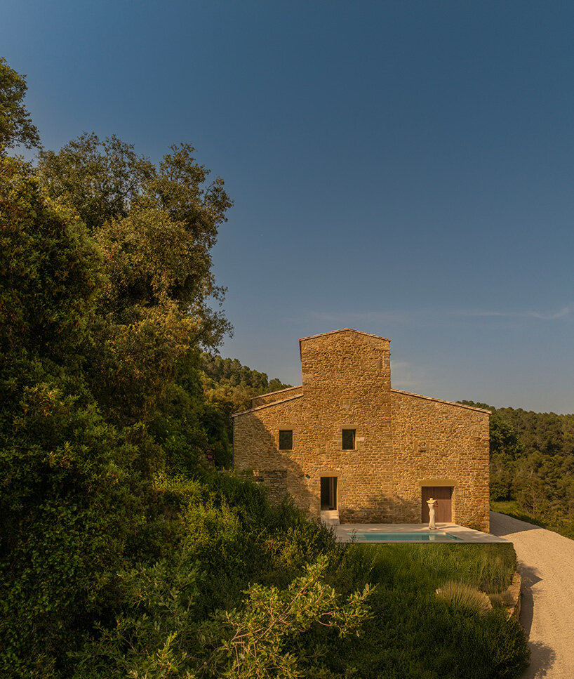 fran silvestre restores limestone farmhouse in spain as off-grid home and workspace