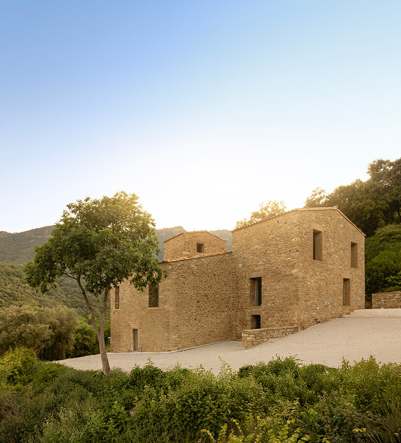 fran silvestre restores limestone farmhouse in spain as off-grid home and workspace