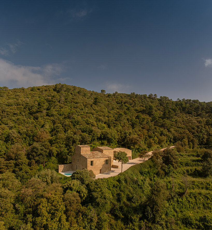 fran silvestre restores limestone farmhouse in spain as off-grid home and workspace